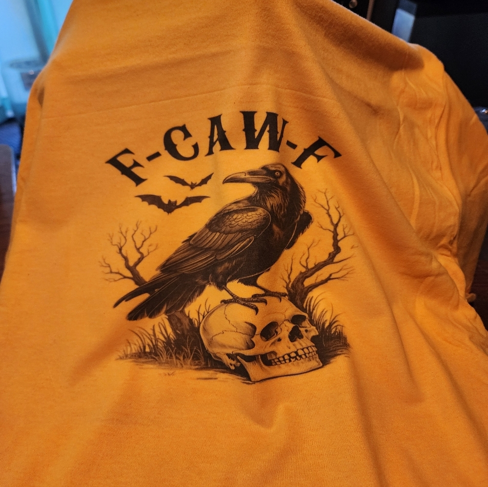 Yellow Graphic Tee with Raven and Skull Design